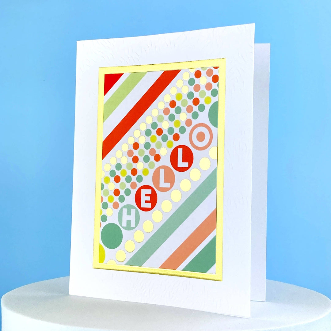 multi colored greeting card that says hello and has dots all over it