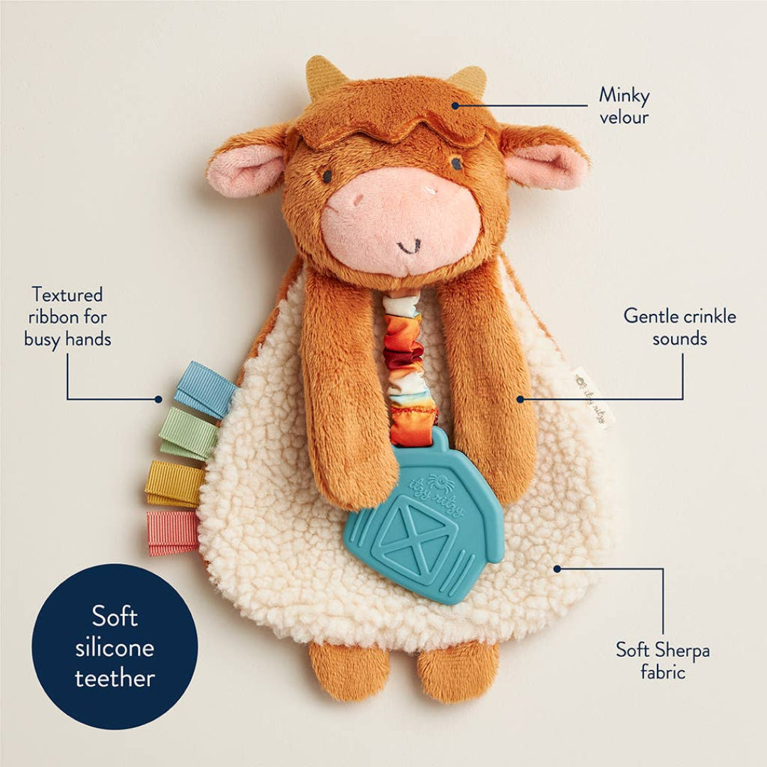 highland cow baby toy with a teether attached