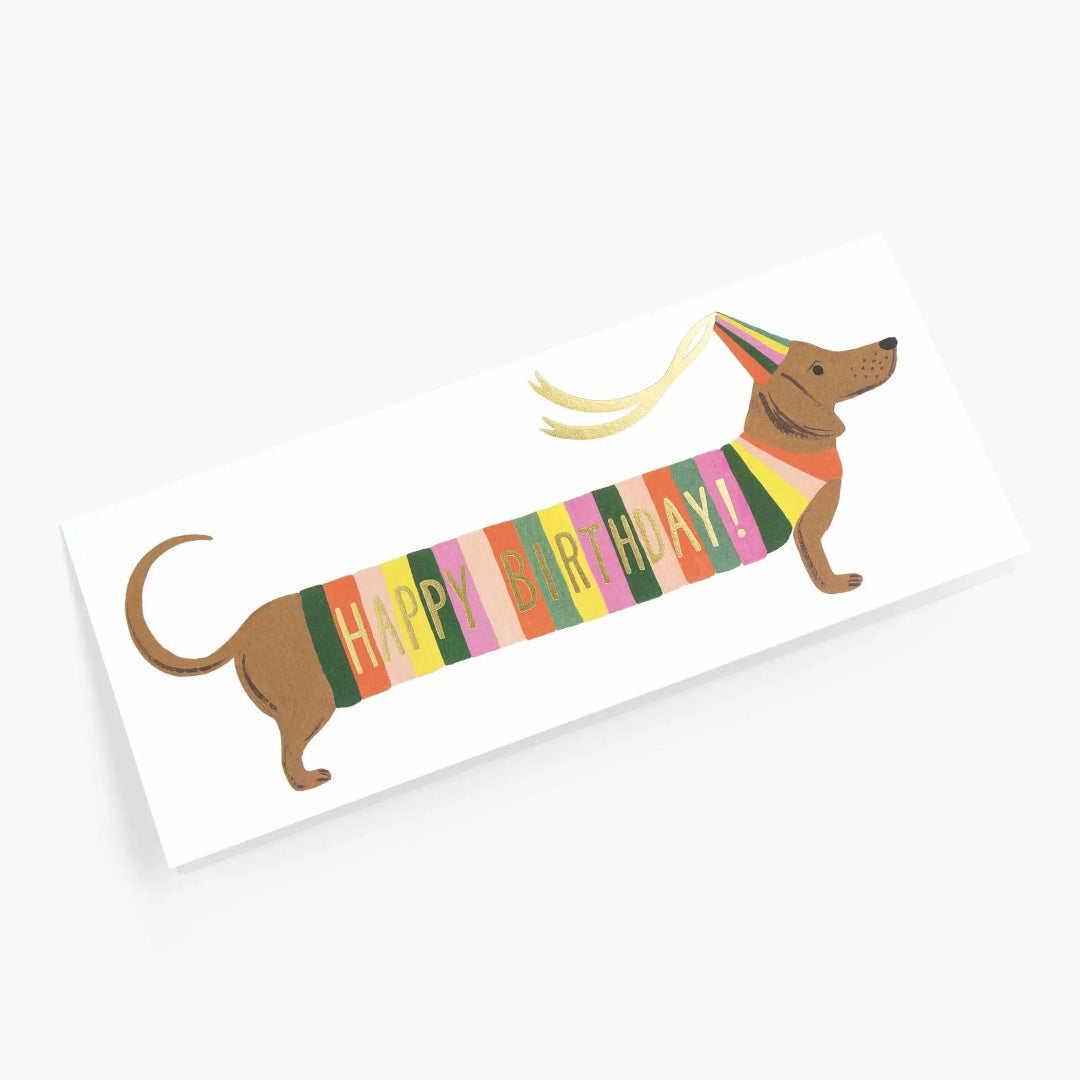 birthday card with a weiner dog wearing a happy birthday sweater and party hat
