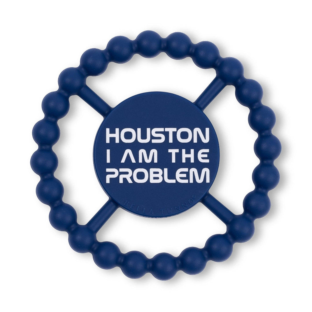 round silicone teether thats dark blue and says houston I am the problem