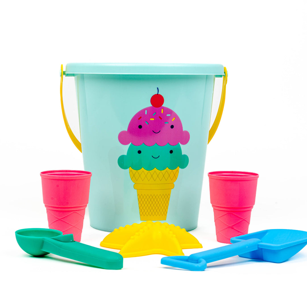 beach toys with an ice cream cone on the bucket