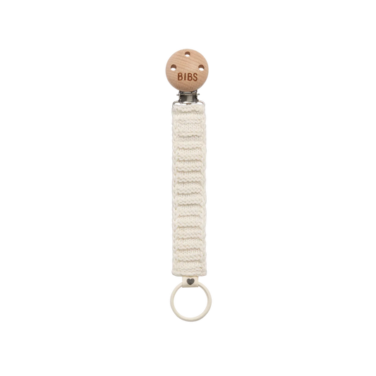 natural woven pacifier clip with wooden connector piece and a ring on the bottom to attach a pacifier