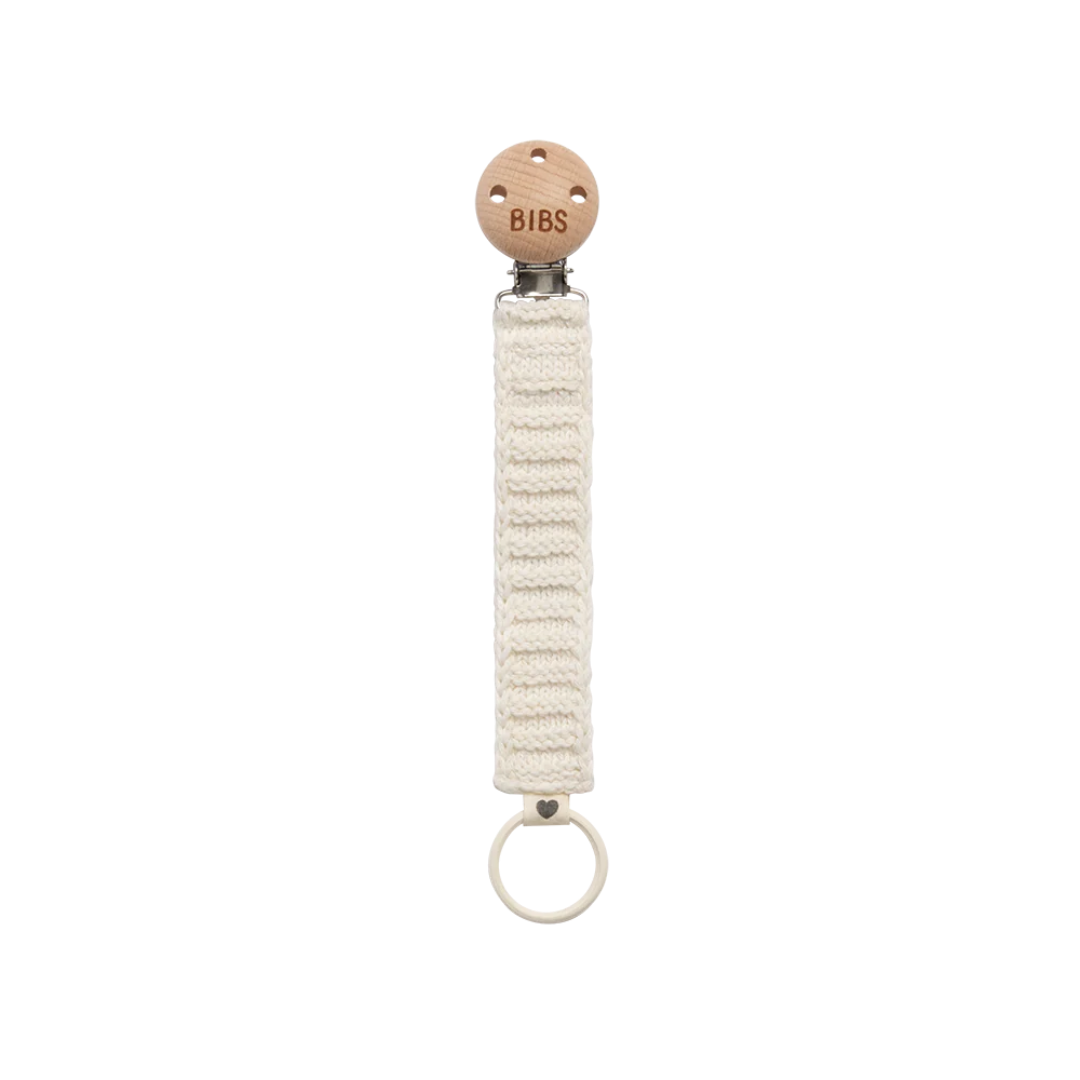 natural woven pacifier clip with wooden connector piece and a ring on the bottom to attach a pacifier
