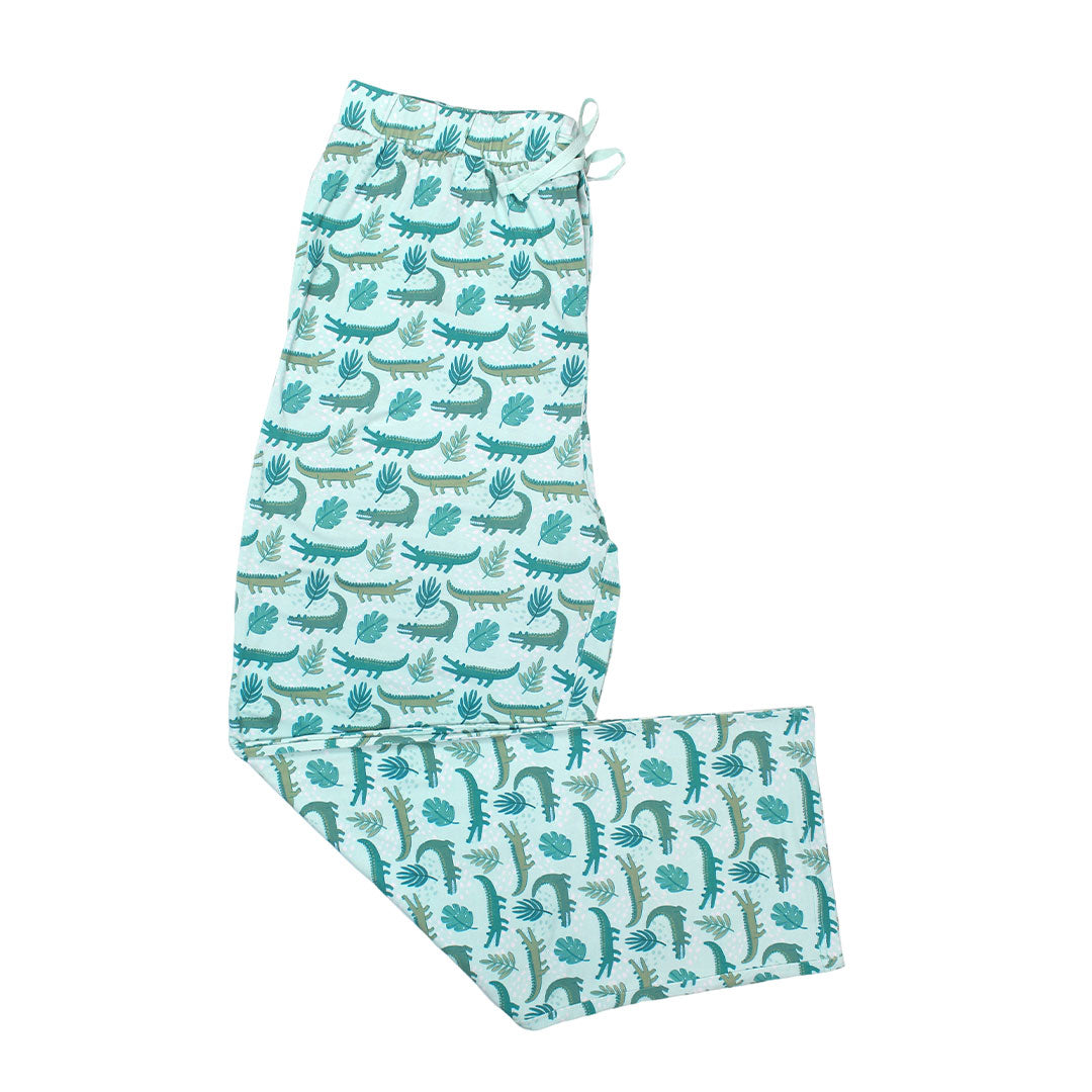 the "later gator" relaxed pants. the "later gator" print has a mix of light and dark green alligators, leaves, and white dots scattered on a teal colored background.
