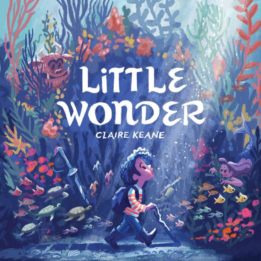 hardcover book called little wonder with a boy wondering across the ocean floor