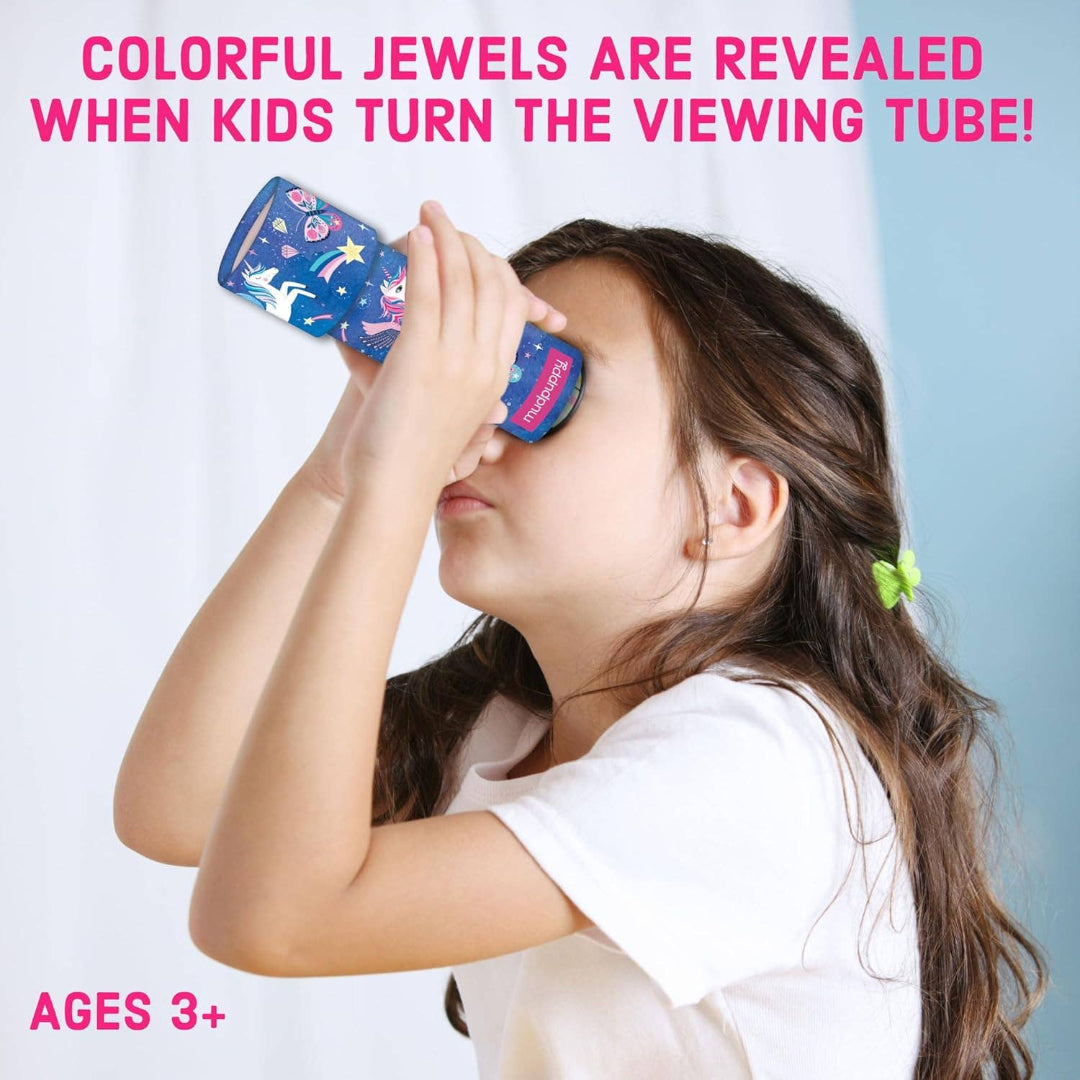 Child using a colorful viewing tube with text about revealing jewels.