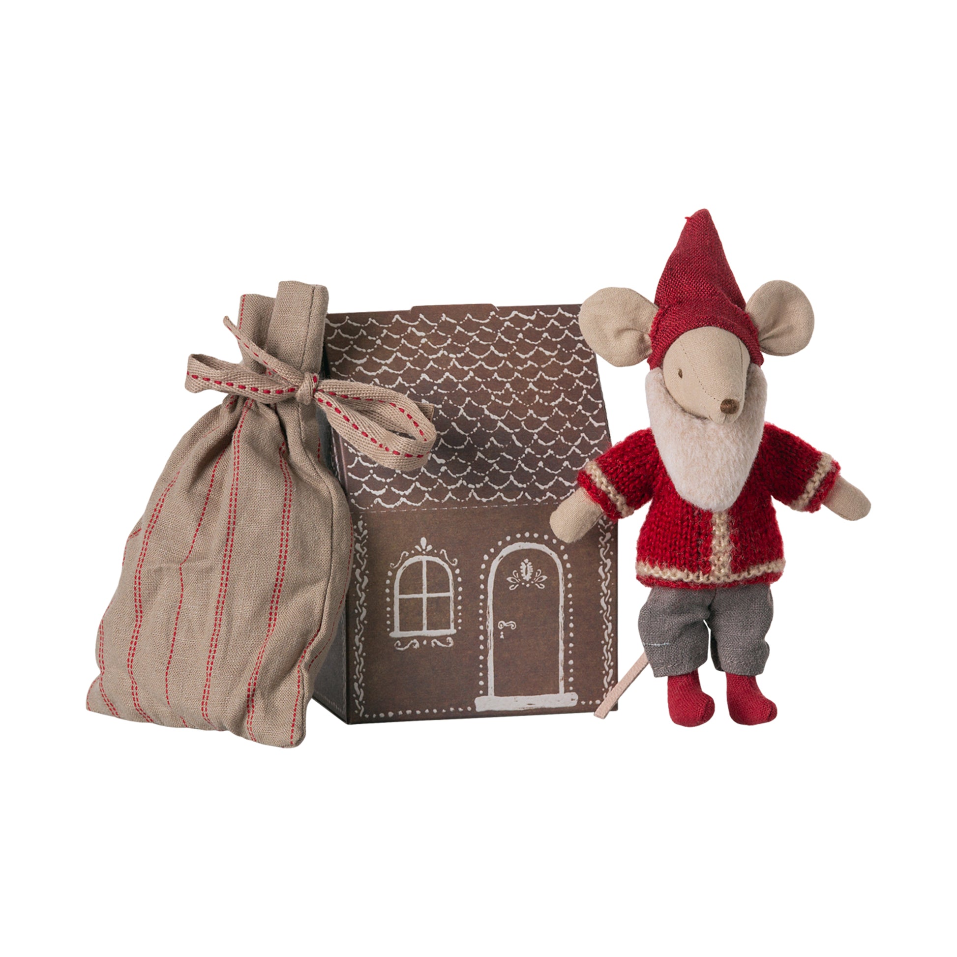 Small mouse figurine in a red outfit with a hat, standing next to a brown house-shaped box and a fabric bag on a white background.