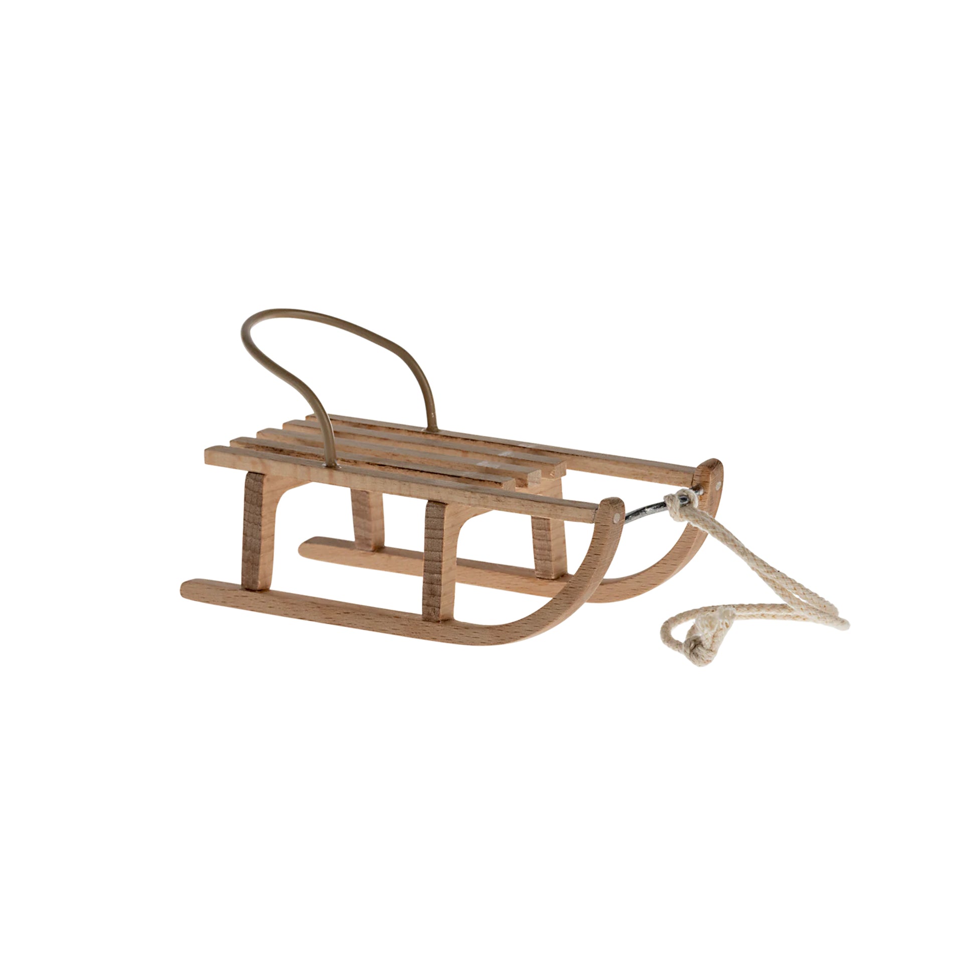 Wooden sled with a rope on a white background