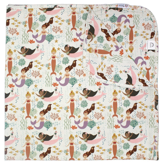 the "making waves" bamboo blanket. the "making waves" print has a diverse spread of mermaids, sea coral, starfish, fish, and bubbles all spread out in different colors. this is all put on a beige background.