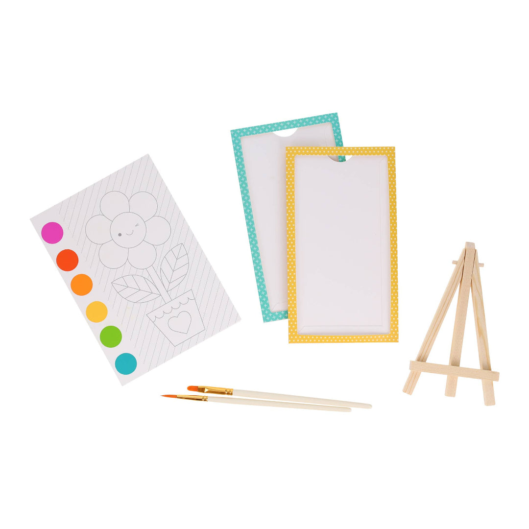 painting supplies including brushes and an easel