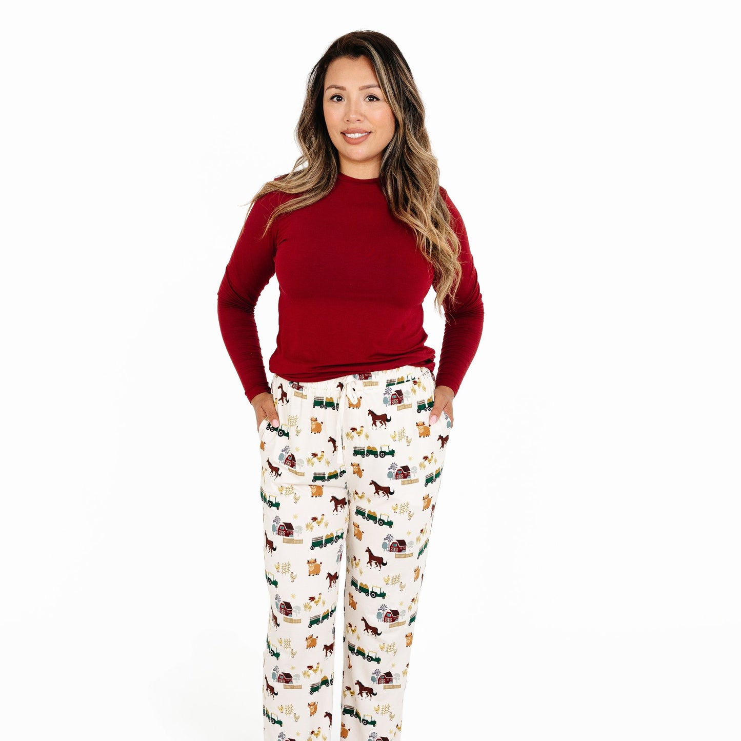 Woman wearing On the Farm bamboo relaxed lounge pajama pants with tractor and horse print, soft and breathable for sensitive skin.