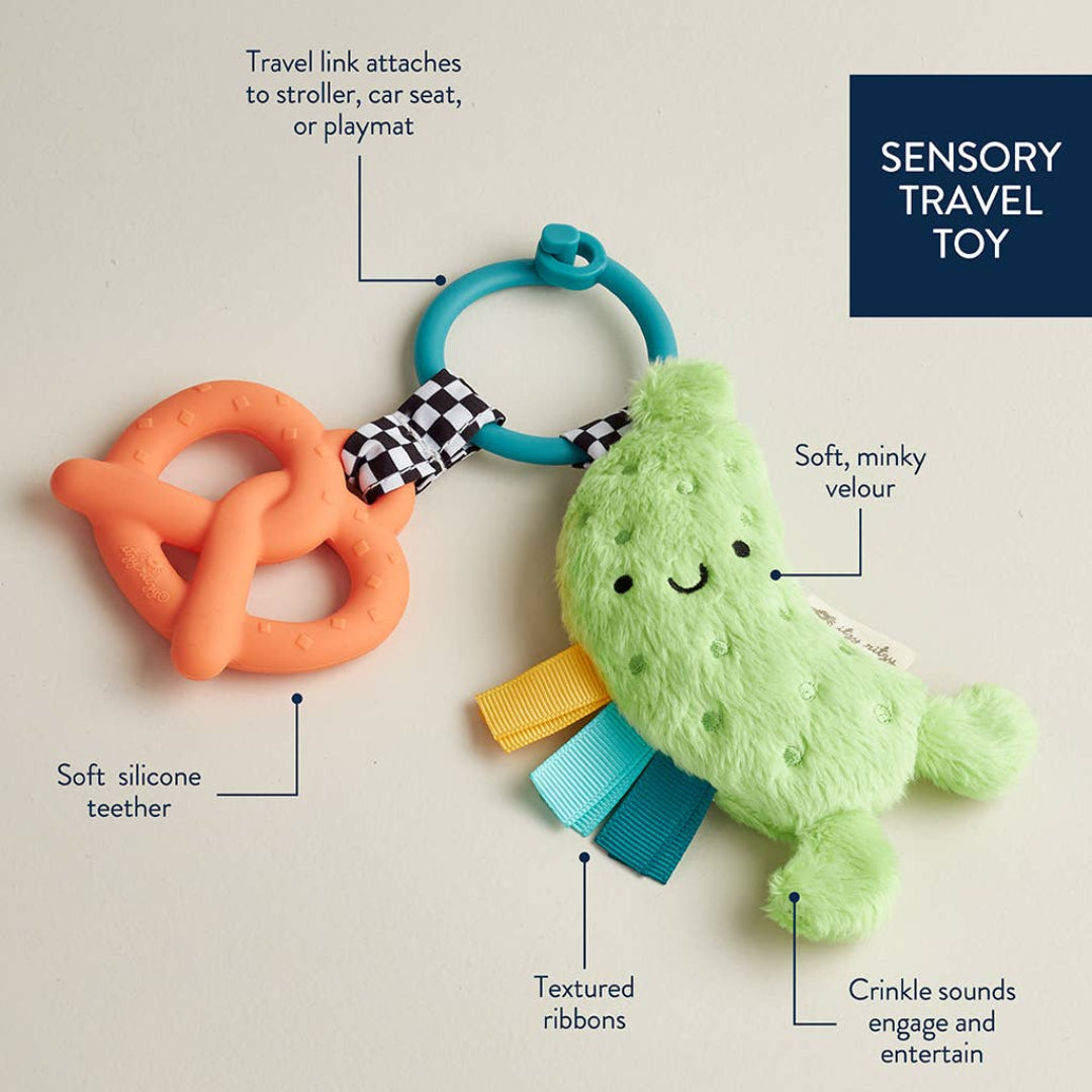 baby teether with a plush pickle and a silicone pretzel