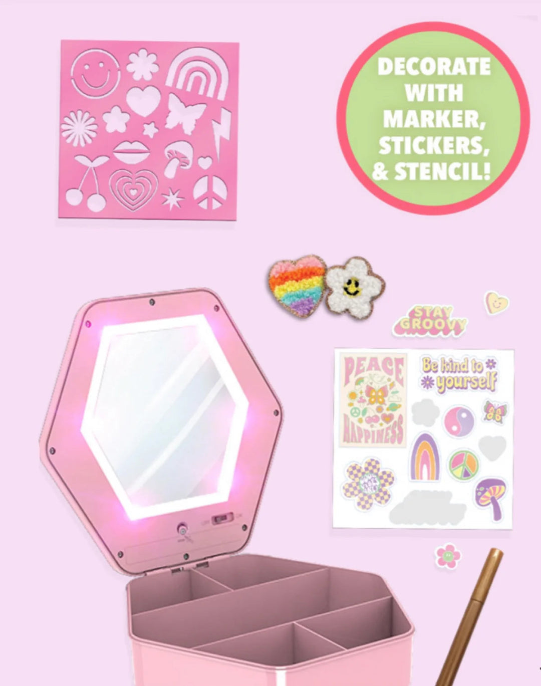 Pink light-up mirror jewelry box with compartments, surrounded by stickers, chenille patches, a stencil, and a marker on a pink background.