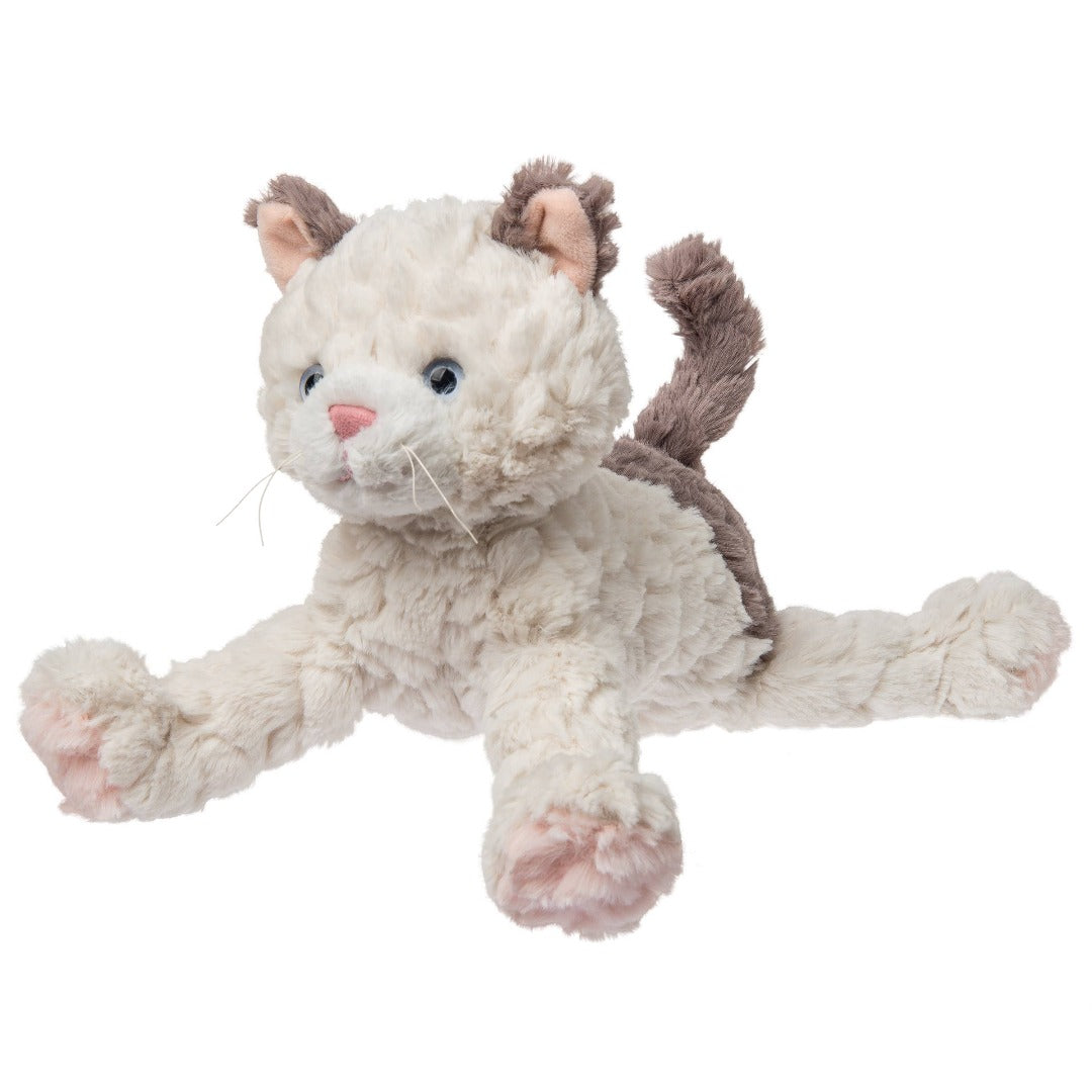 fluffy stuffed kitty thats white with brown on its ears and tail and blue eyes