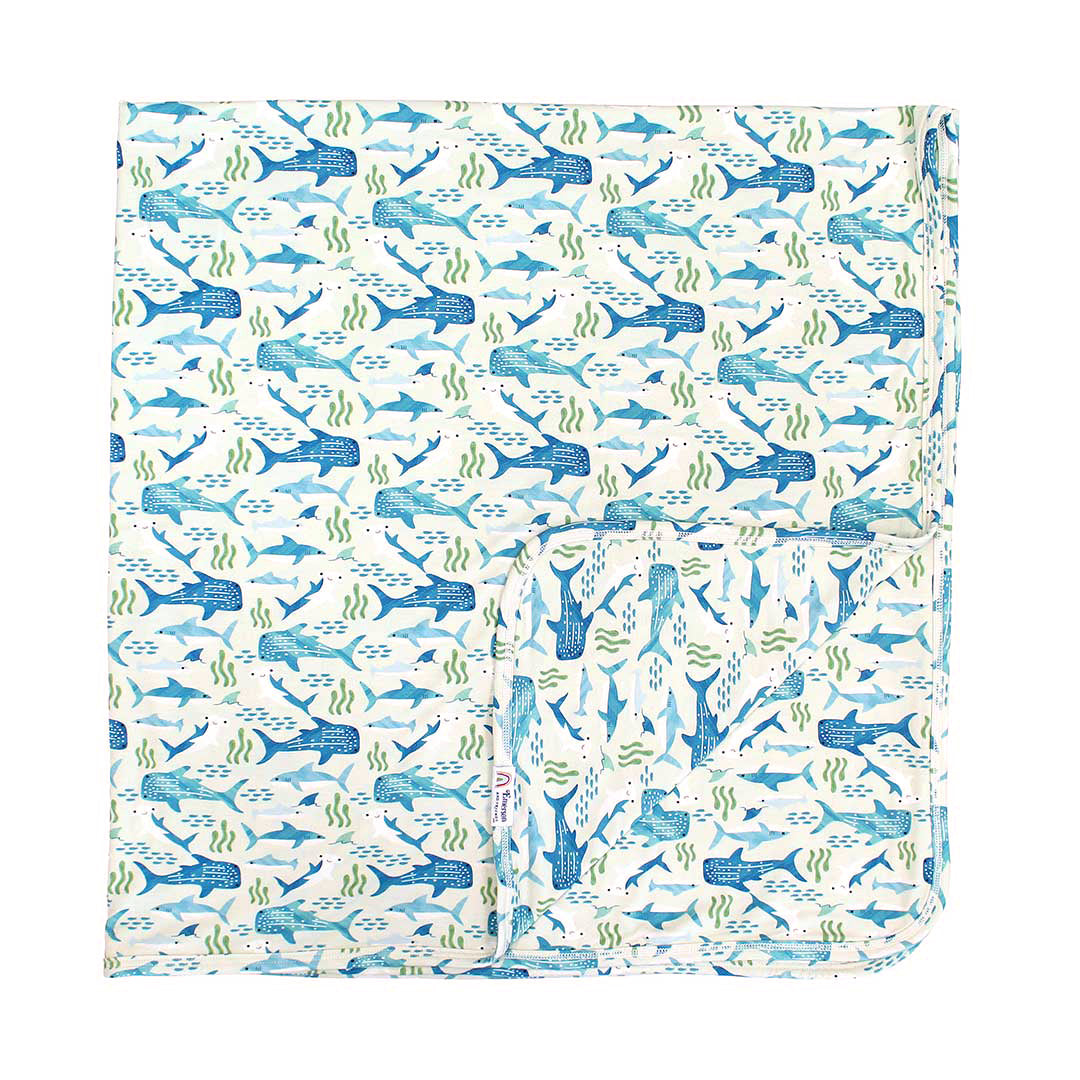 Flat lay image of our Shark Friends Bamboo Blanket.