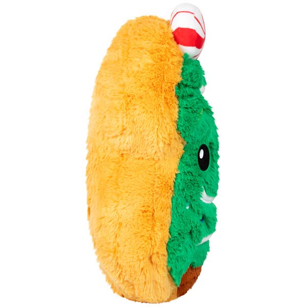 Plush toy resembling a taco with a face on a white background