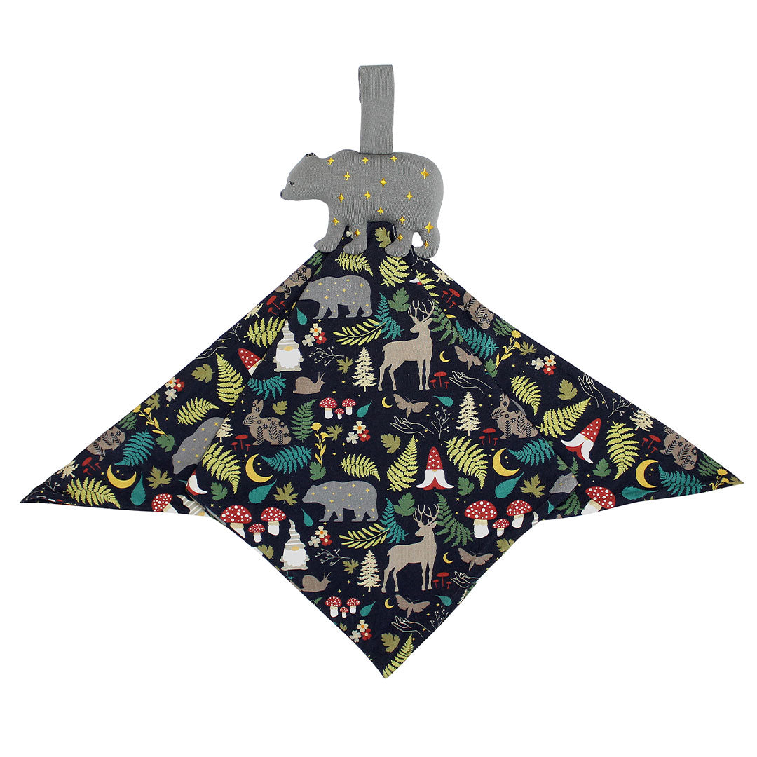 the "night forest" lovey is a blanket with the night forest print and a bear attached to it. the "night forest" print is a night time themed design. you can see an array of forest animals ranging from, deer, bears, bunnies, birds, forest trees and leaves, flowers, and mushrooms. there are also starts and moons scattered around to enhance the night time atmosphere.