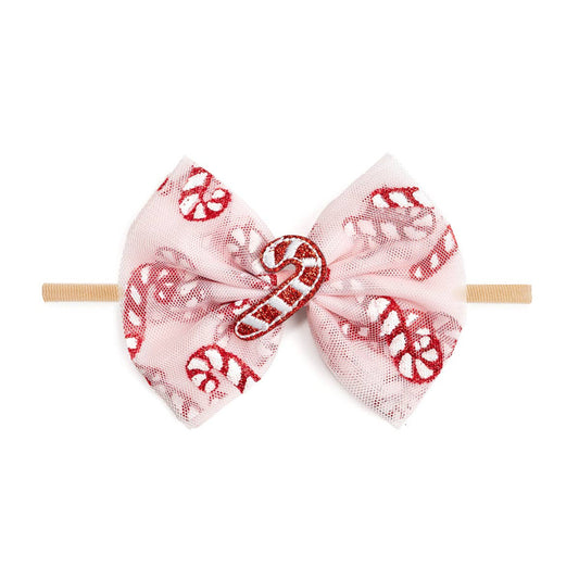 Pink baby headband with a large tulle bow decorated with red glitter candy cane patterns, featuring a glittery candy cane embellishment in the center.