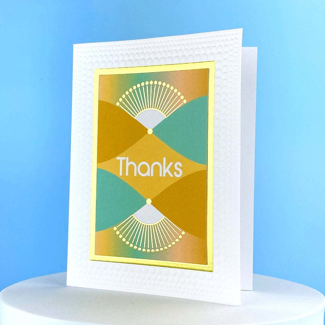 multi colored greeting card that says thanks and is blank inside