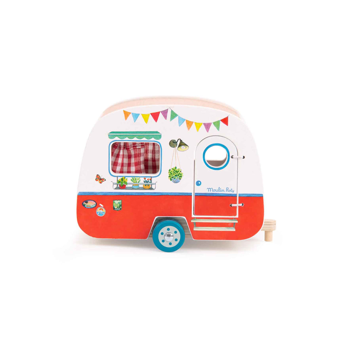 a wooden toy caravan thats red along the bottom white white at the top, it has a door on the front and a window and a removable roof