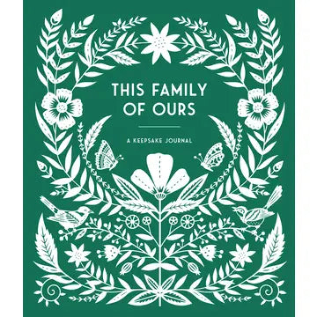 hardcover keepsake journal that is green with white flowers on the cover