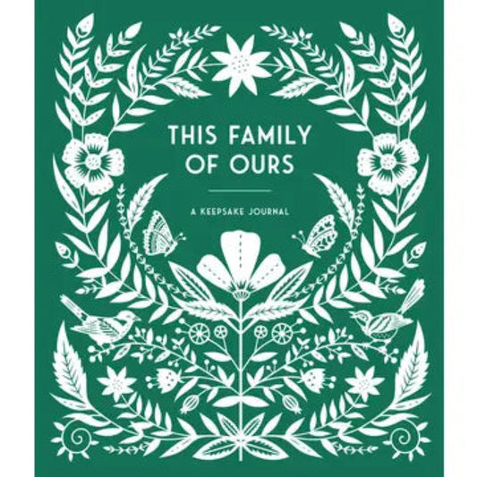 hardcover keepsake journal that is green with white flowers on the cover