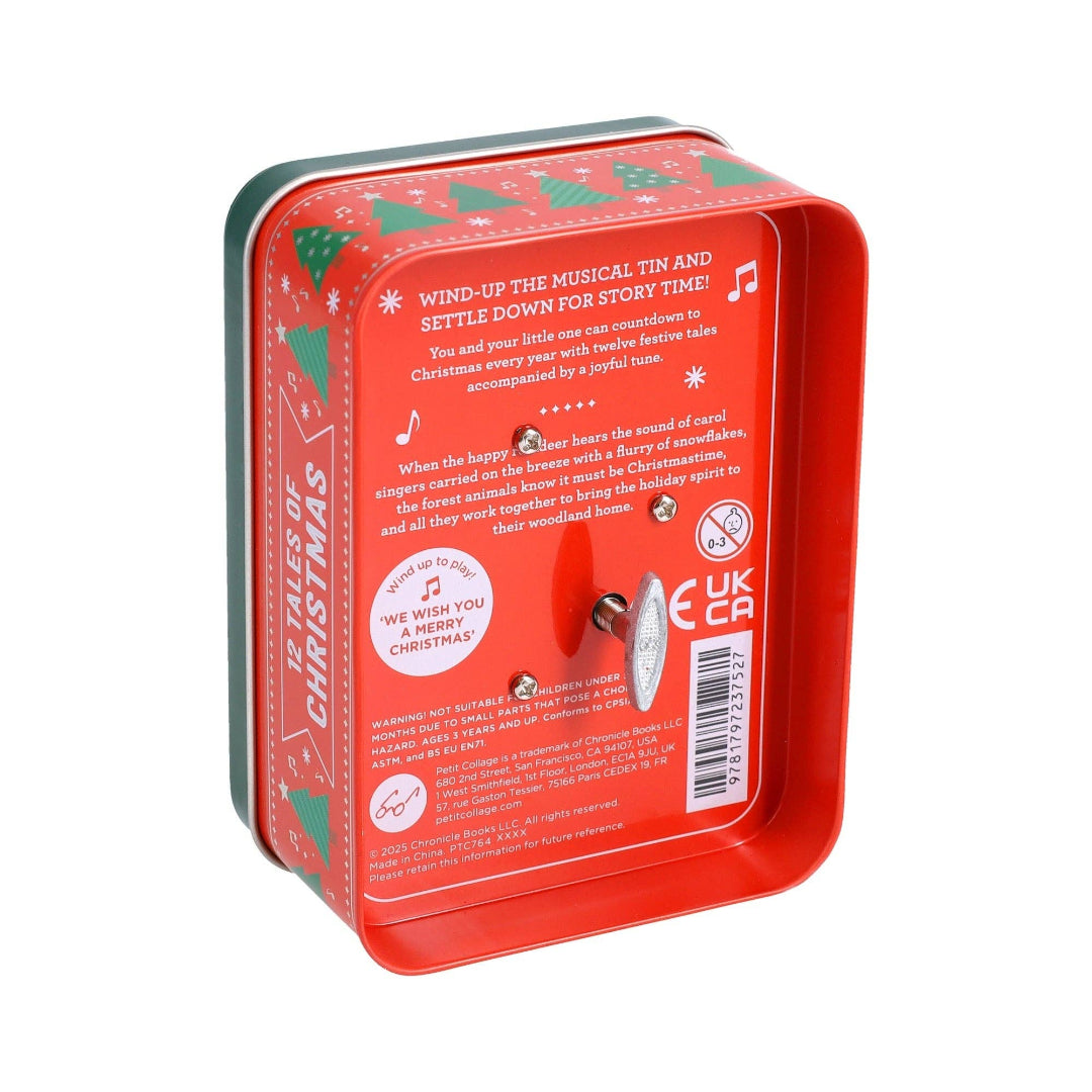 Red wind-up musical tin with Christmas design on a white background