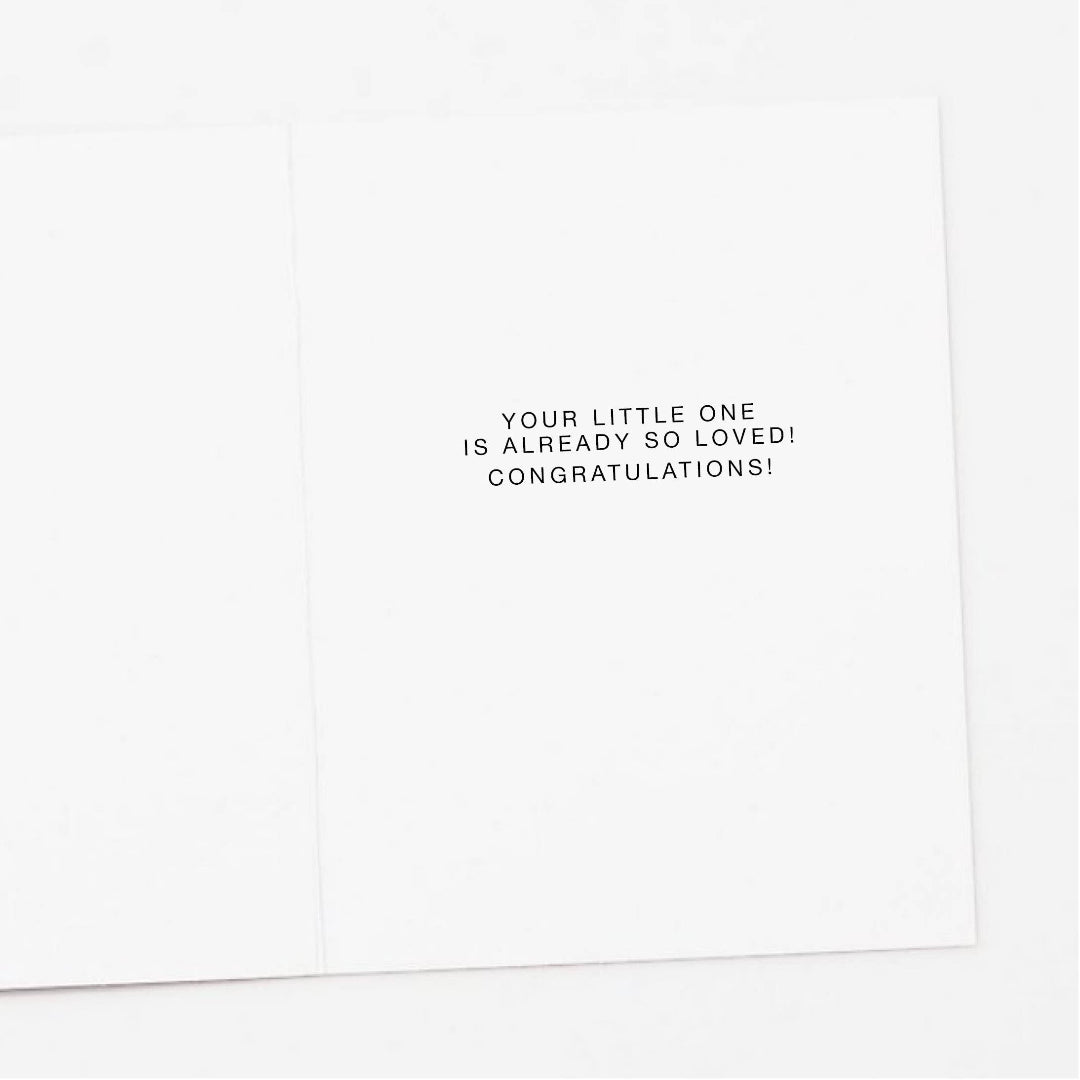 Inside of greeting card that says "your little one is aready so loved! congratulations"