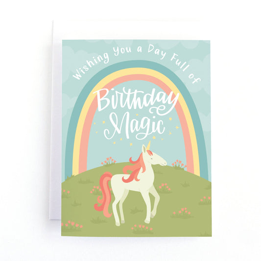 birthday card with a unicorn under a rainbow that says wishing you a day full of birthday magic