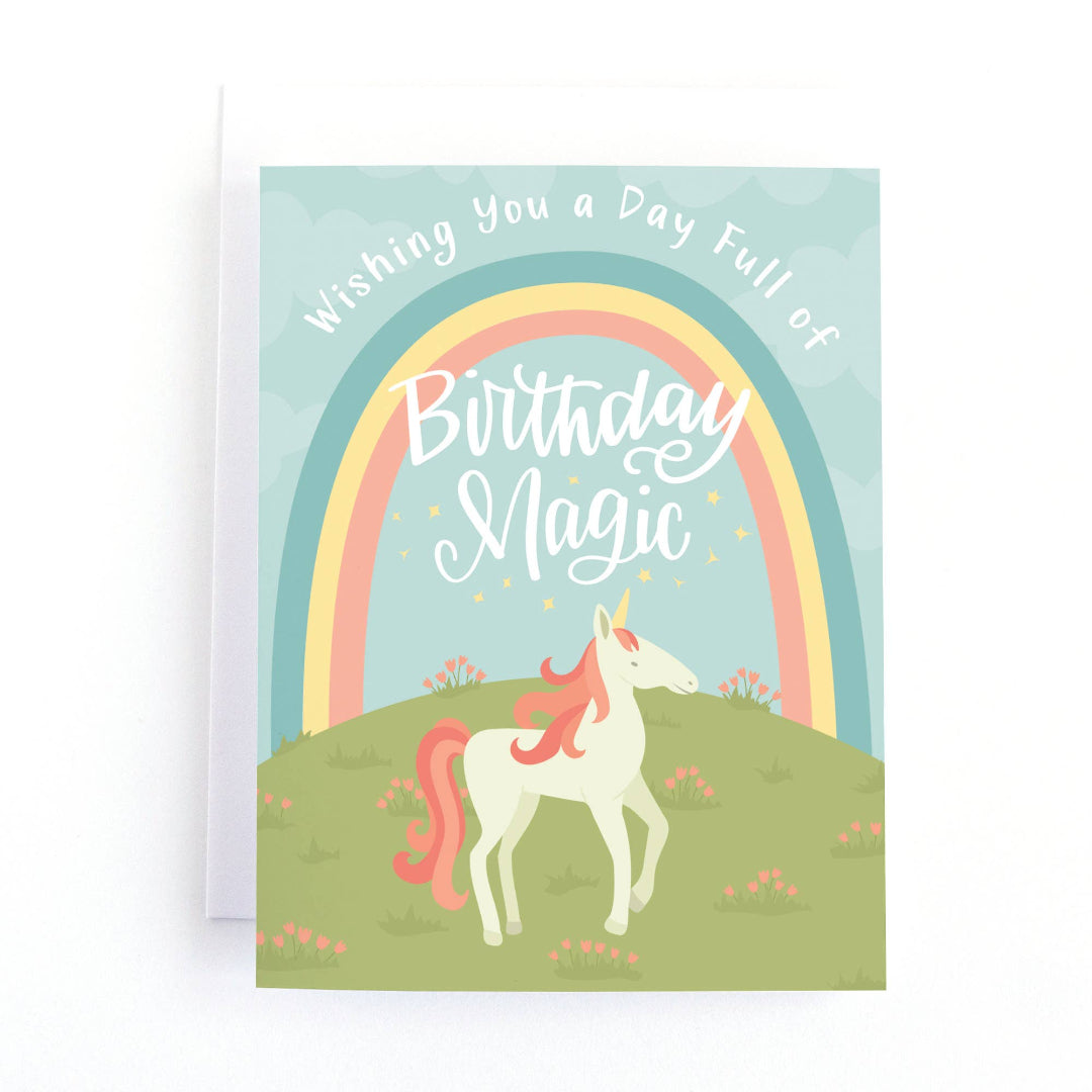 birthday card with a unicorn under a rainbow that says wishing you a day full of birthday magic