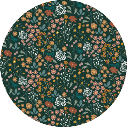 Round fabric swatch with a floral pattern on a dark green background