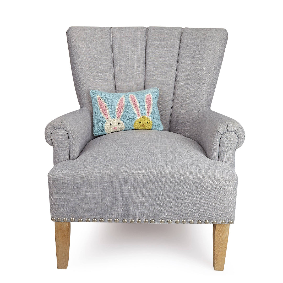 easter themed pillow on an oversized chair