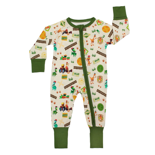 All Aboard the Dino Train bamboo convertible baby pajamas with green trim, double zipper, and colorful orange, blue, and green dinosaurs on train tracks with "Dino Train" print.
