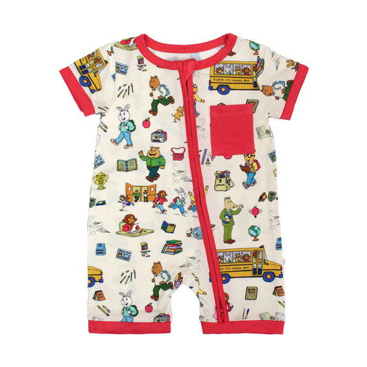 Flat lay Bamboo baby shortie romper crafted from buttery-soft bamboo, featuring red trims and playful illustrations of Arthur™ PBS Character, books, and school bus, a beige background.