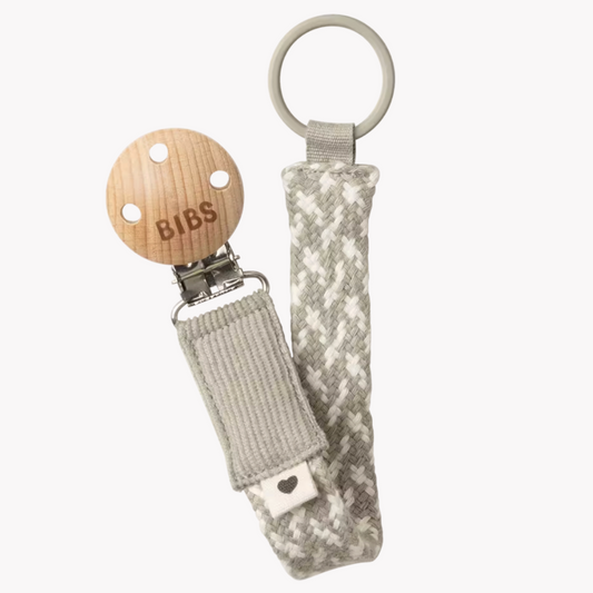 BIBS wooden teether with camouflage pouch on a white background