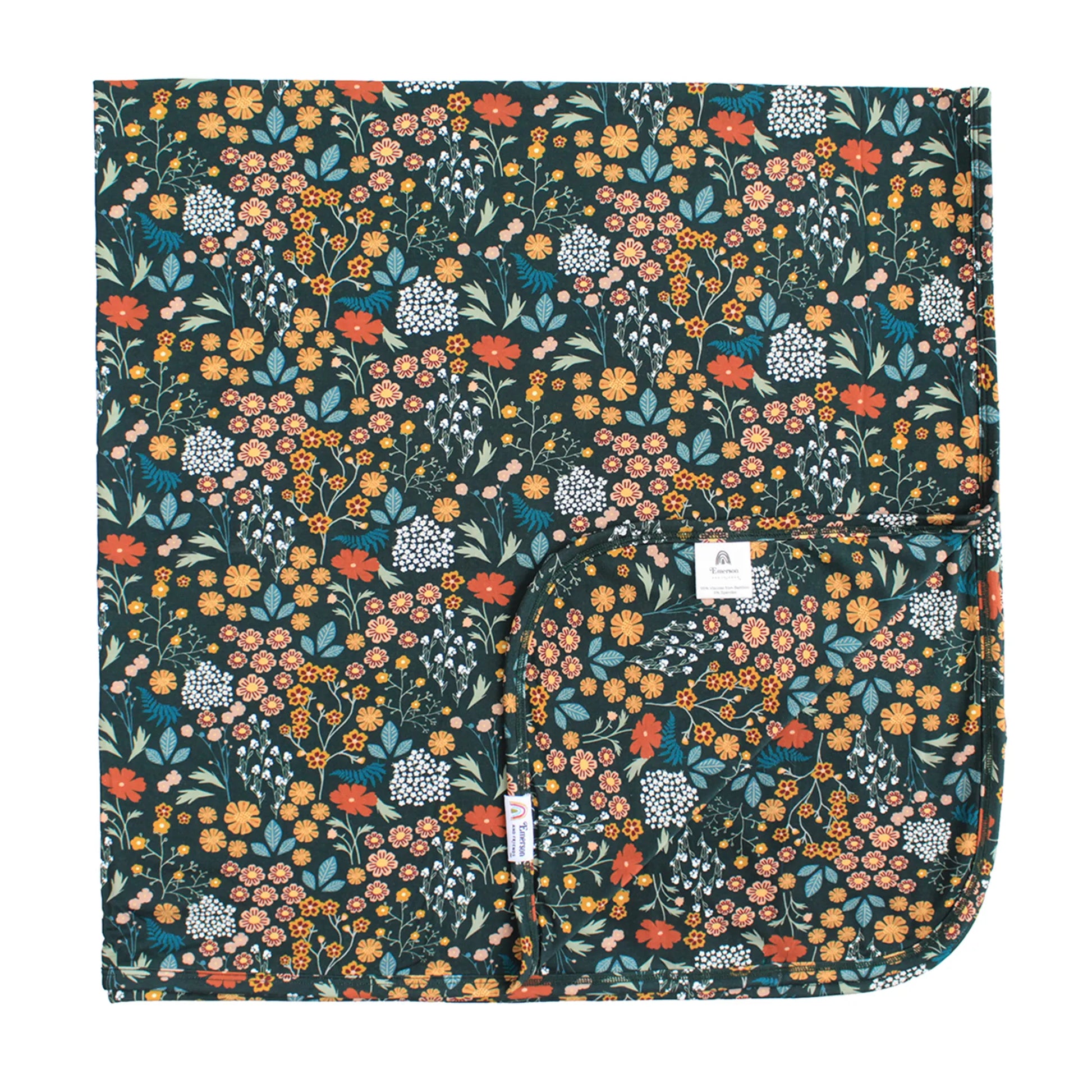 dark green bamboo blanket with floral print on white background. 