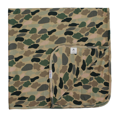 bamboo blanket with camo print on white background.