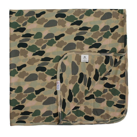 bamboo blanket with camo print on white background.
