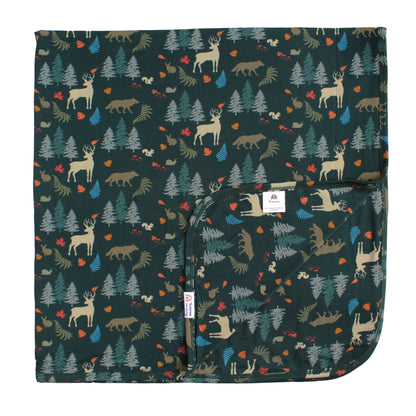 bamboo blanket with forest print on white background.