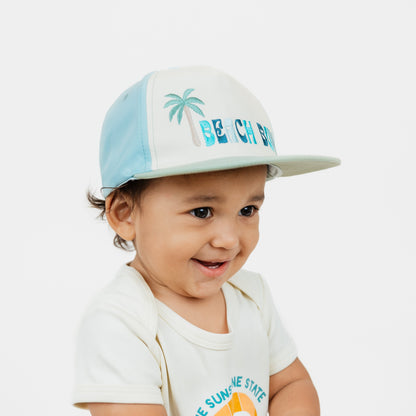 Kid wearing our Beach Bum Snapback Hat.