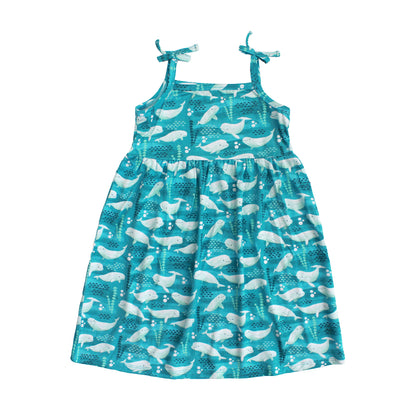 Blue dress with whale pattern on a white background