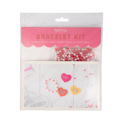 Bracelet kit packaging with heart-shaped charms and beads on a white background