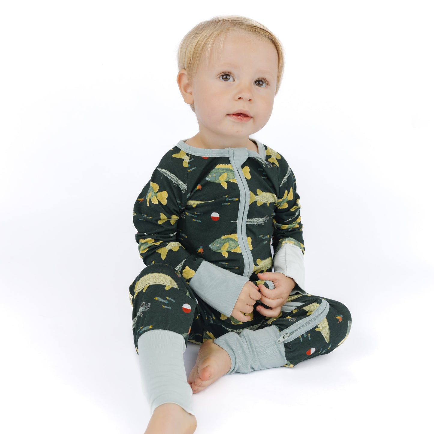 little boy wearing a fish print zipper convertible