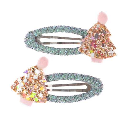 Hair clips with a soft mint-colored braided base, topped with a sparkling pink and gold Christmas tree from Great Pretenders