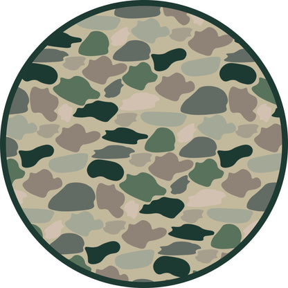 Circular camouflage pattern with green, brown, and beige colors on a white background