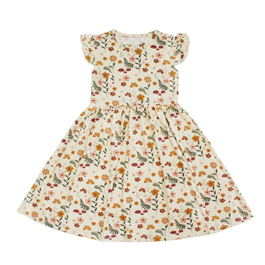 cream dress with mushroom print on white background.