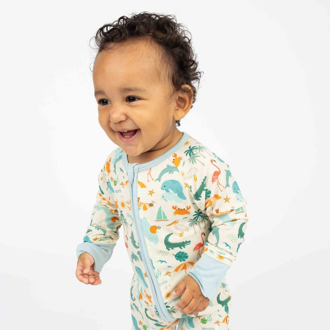 Soft and breathable bamboo convertible pajama featuring a vibrant Florida-themed print with foldable hand and feet covers for babies and toddlers.