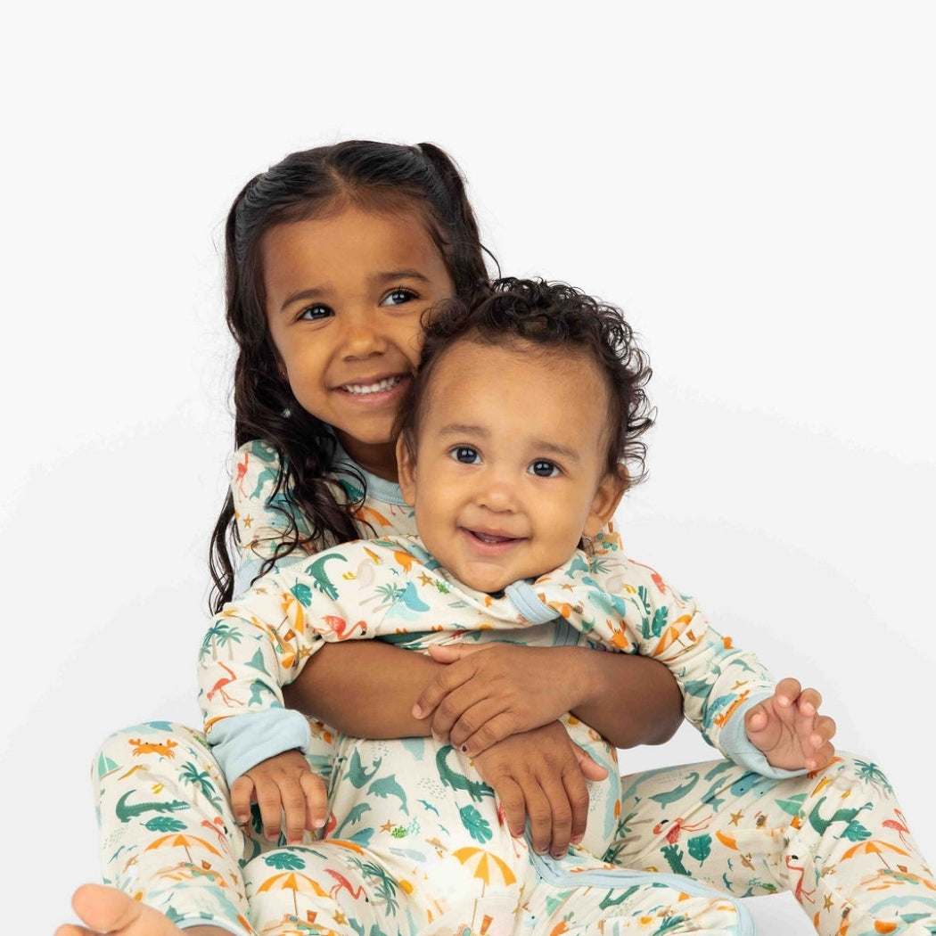 Soft and breathable bamboo convertible pajama featuring a vibrant Florida-themed print with foldable hand and feet covers for babies and toddlers.