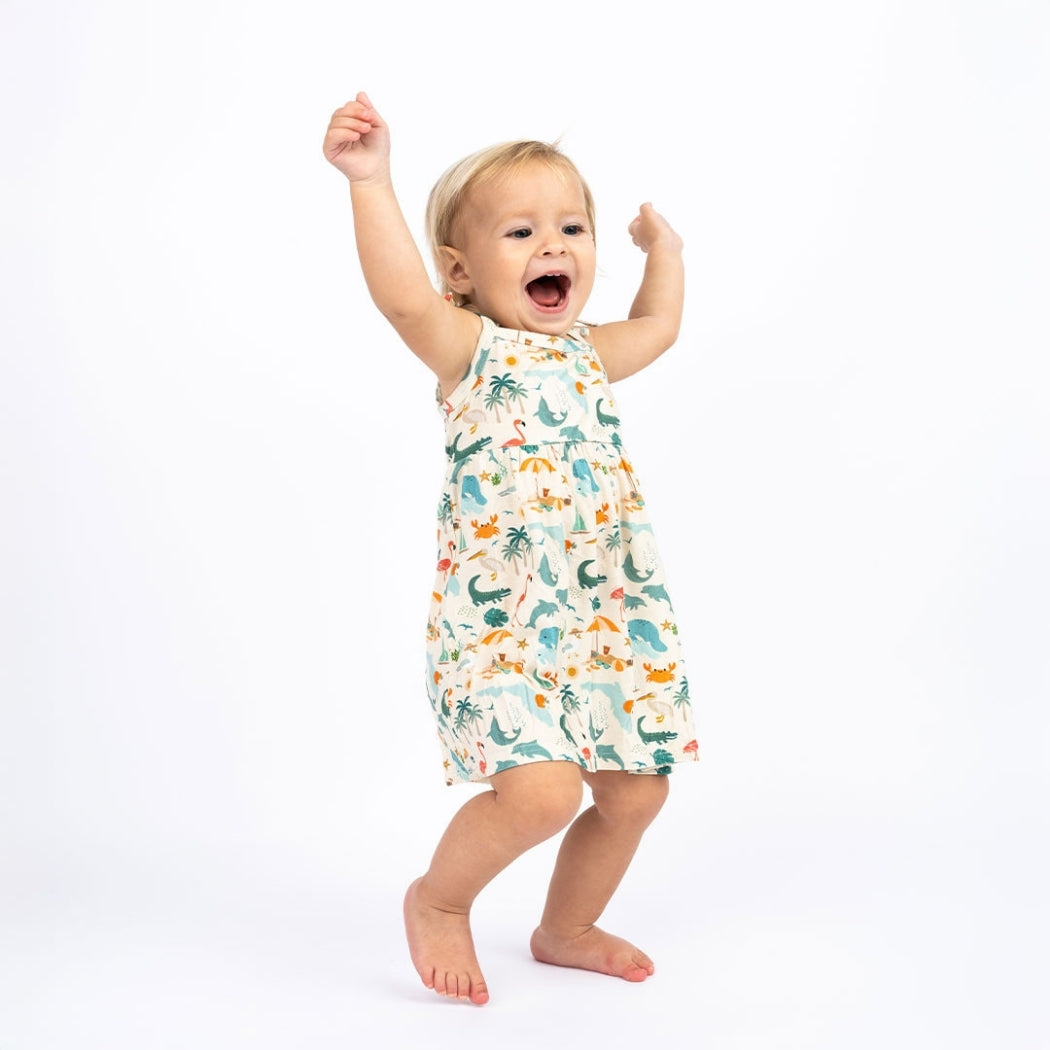 Soft and breathable bamboo day dress featuring a vibrant Florida-themed print and adorable tie shoulders, perfect for babies, toddlers, and kids to wear in comfort and style.