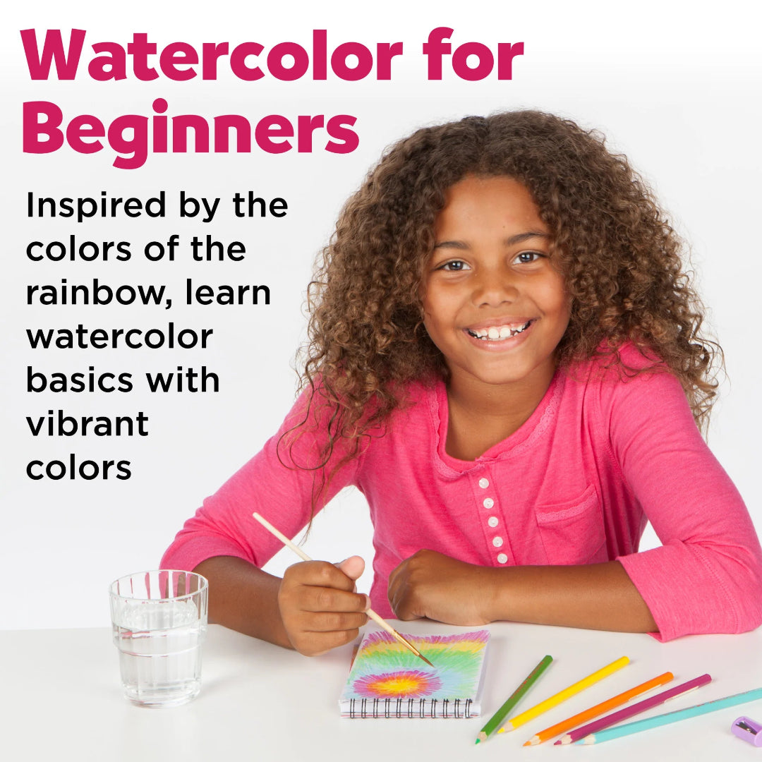 Young girl in pink shirt painting with watercolors on a white background